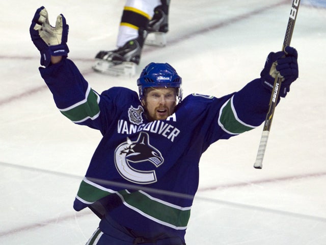Daniel Sedin celebrates after scoring 