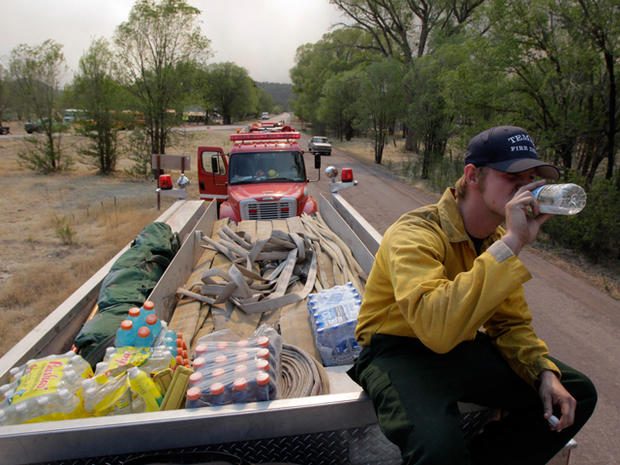 firefighter drinks water while resting  