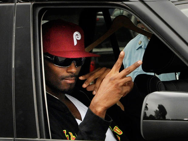 Plaxico Burress gestures from a car after being released from prison 