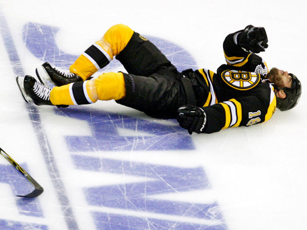 Nathan Horton lies on the ice after being checked to the ice 
