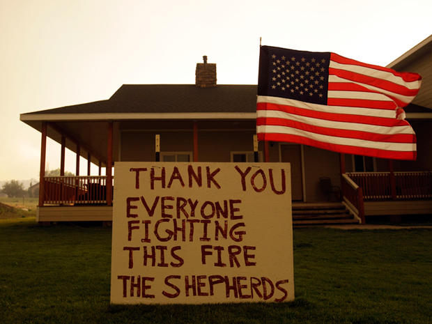 A sign outside of a home thanks firefighters for their efforts  