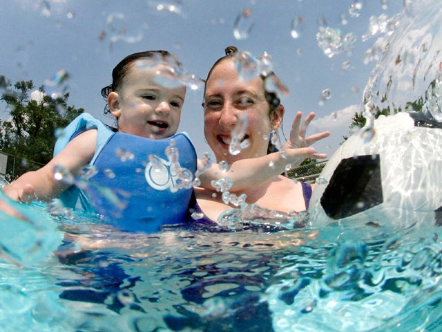 Cheri Herschell, right, holds her 20-month-old son Wyatt  