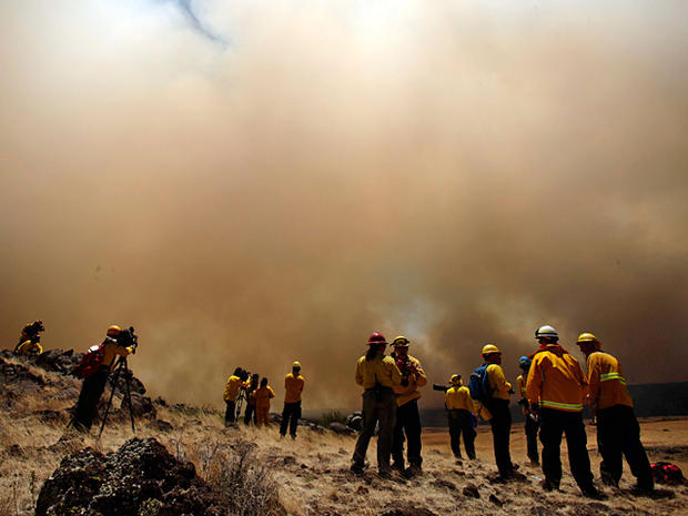 Members of the media watch the Wallow Fire 