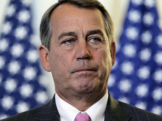 House Speaker John Boehner talks to the press following a political strategy session on Capitol Hill in Washington, June 14, 2011. 