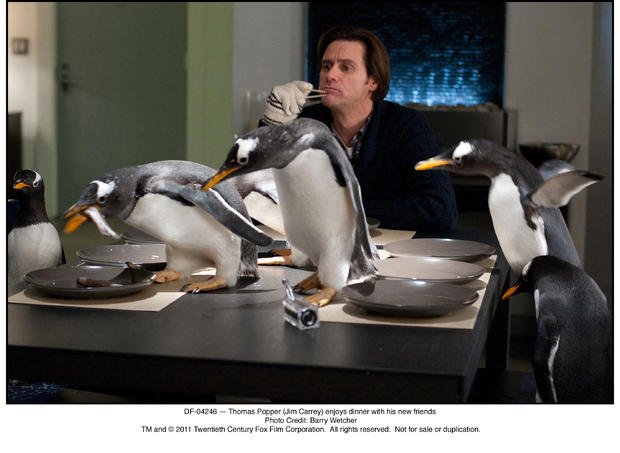 DF-04246 â€” Thomas Popper (Jim Carrey) enjoys dinner with his new friends 