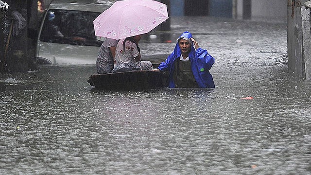 China floods prompt hundreds of thousands to evacuate. 