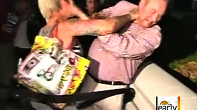 Fight breaks out among people in line hoping to get tickets to get into courtroom to watch Casey Anthony murder trial in Orlando, Fla. early in the morning on June 17, 2011. 