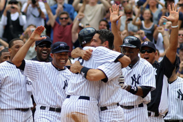 Derek Jeter celebrates with teammates 