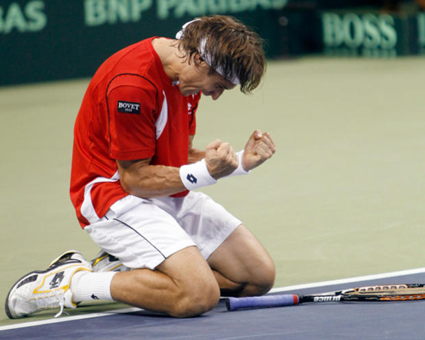 David Ferrer reacts after defeating Mardy Fish 