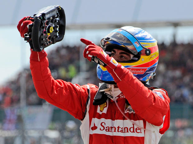 Fernando Alonso celebrates after winning the British Grand Prix  