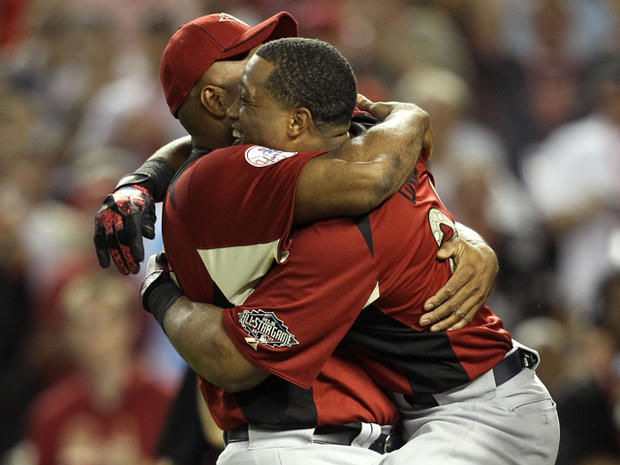 Robinson Cano hugs his father Jose after winning Home Run Derby  