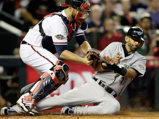 Jose Bautista  is tagged out by Brian McCann 