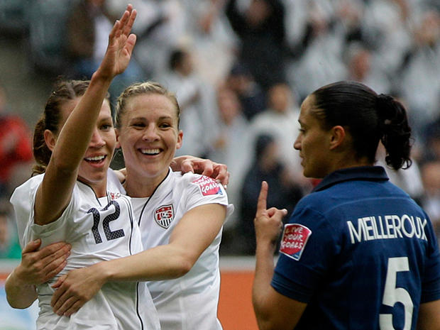 United States' Lauren Cheney, left, celebrates scoring the opening goal 