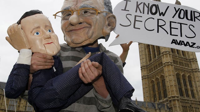 Murdoch_Cameron_masks_tAP110713010681.jpg 