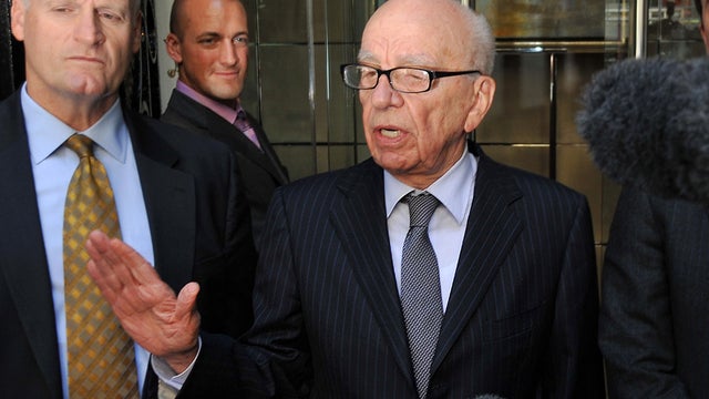Rupert Murdoch speaks to reporters in London 