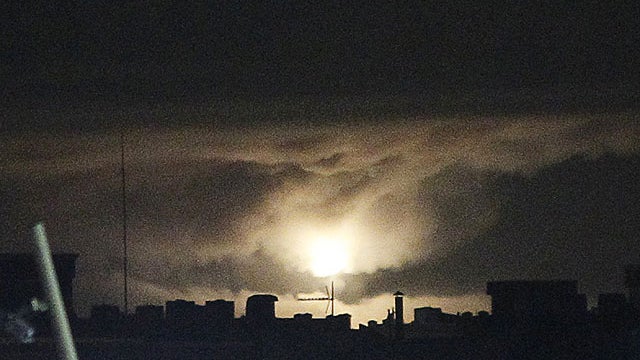 An explosion is seen following an airstrike in Tripoli, Libya, July 17, 2011.  