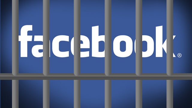 Facebook logo behind prison bars 