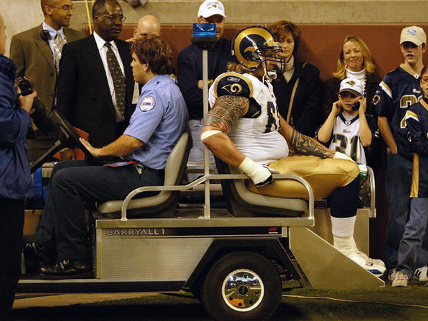  Kyle Turley of the St. Louis Rams is carted off the field 