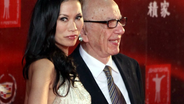 Rupert Murdoch and Wendi Deng Murdoch arrive at the opening ceremony of the 14th Shanghai International Film Festival June 11, 2011, in Shanghai. 