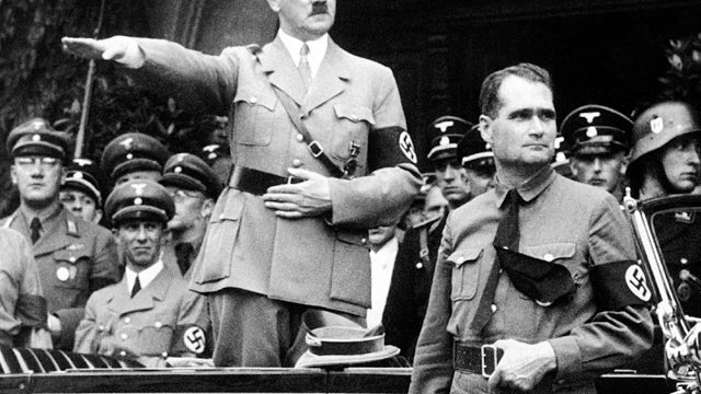 German Chancellor Adolf Hitler and his personal representative, Rudolf Hess, right, are seen during a parade in Berlin Dec. 30, 1938. Minister of Propaganda Dr. Joseph Goebbels can be seen on the left side next to Hitler. The skeletal remains of Hess have 