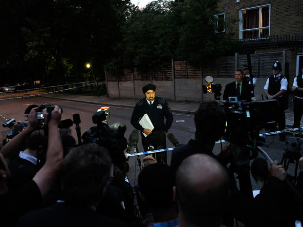 A police officer makes a statement to the press and public about the death of English pop star Amy Winehouse at her north London home on July 23, 2011. 