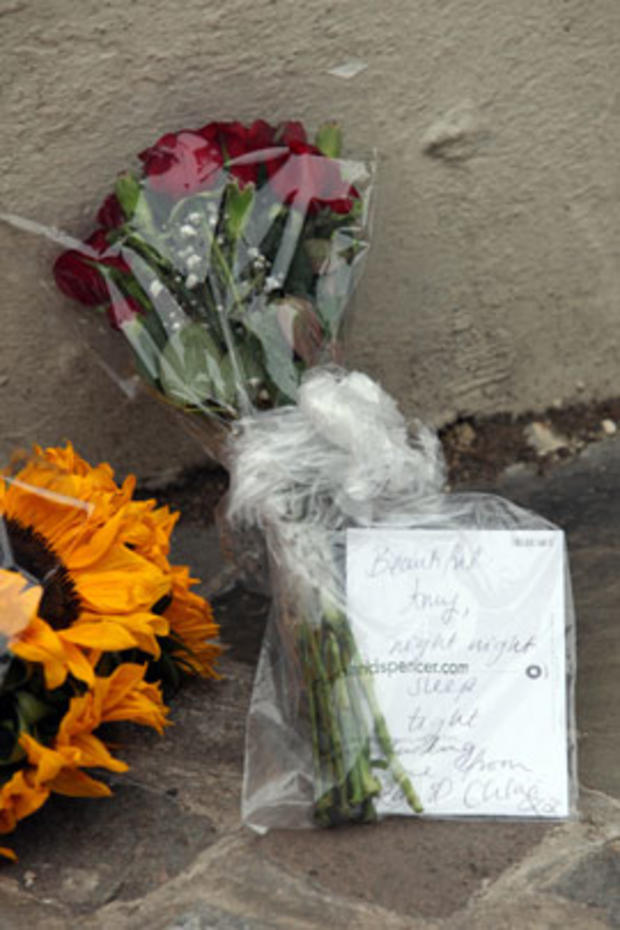 A floral tribute is left outside Amy Winehouse's North London home on July 23, 2011 in London, England.  
