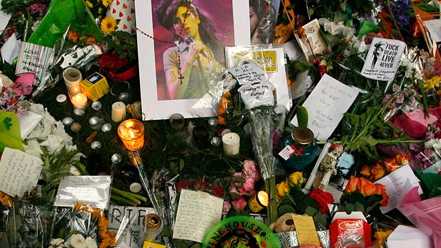 Floral tributes and messages are seen outside the residence of singer Amy Winehouse 
