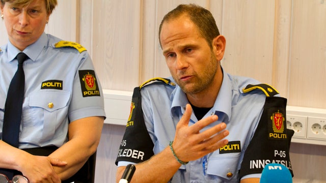 Police Officer Haavard Gaasbakk, right, and Chief of Police Sissel Hammer are seen during a press briefing in Hoenefoss, Norway, July 27, 2011. Police have come under close scrutiny over how long it took them to reach an island youth camp after first repo 