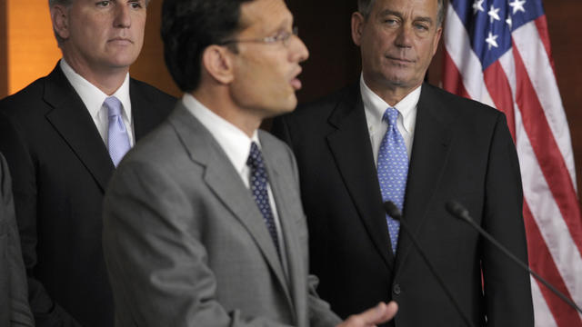 House Speaker John Boehner of Ohio, right, and House Majority Whip Kevin McCarthy of Calif., left, listen as House Majority Leader Eric Cantor of Va., center, speaks during a news conference on Capitol Hill in Washington, Thursday, July 28, 2011.  