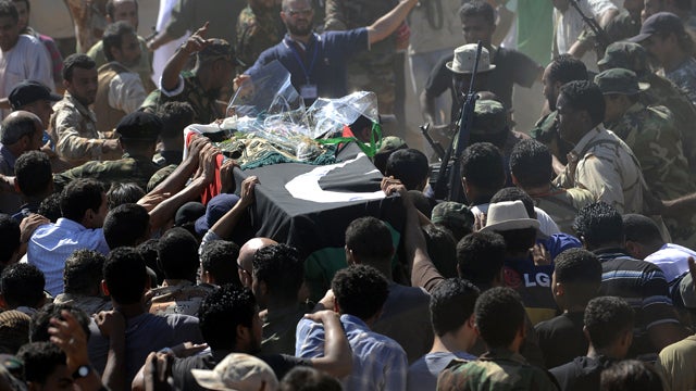 Thousands of Libyan rebel fighters and relatives attend the funeral of Libyan rebel army chief Abdel-Fattah Younis in the rebel-stronghold city of Benghazi July 29, 2011, a day after his murder. 