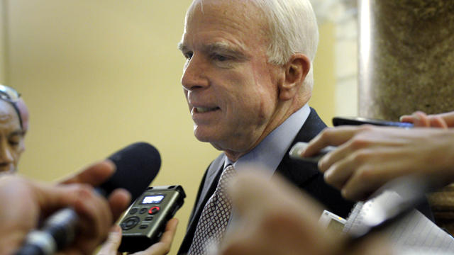 Sen. John McCain, R-Ariz., talks with reporters on Capitol Hill in Washington July 31, 2011. 