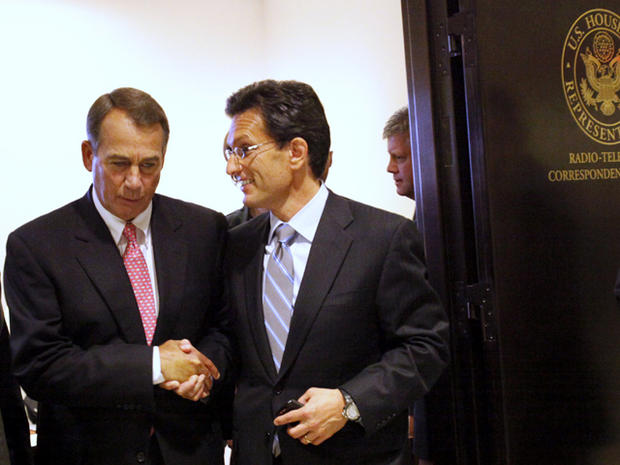 House Speaker John Boehner of Ohio, left, shakes hands with House Majority Leader Eric Cantor of Virginia as they leave a news conference on Capitol Hill in Washington Aug. 1, 2011. 