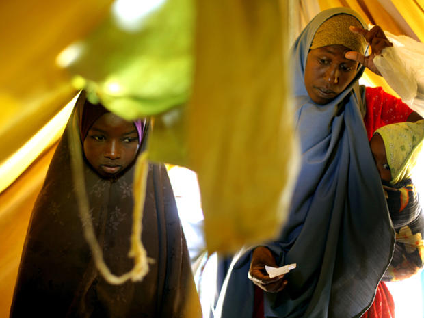 Somali refugees receive soap and an oil container as they check in at a United Nations camp outside Dadaab, Kenya, 60 miles from the Somali border Aug. 5, 2011. The camp, registering more than 1,000 newcomers a day, has been set to provide better accommodations, sanitary conditions and security for Somali refugees. The drought and famine in the Horn of Africa has killed more than 29,000 children under the age of 5 in the last 90 days in southern Somalia alone, according to U.S. estimates. The U.N. says 640,000 Somali children are acutely malnourished, suggesting the death toll of small children will rise. 