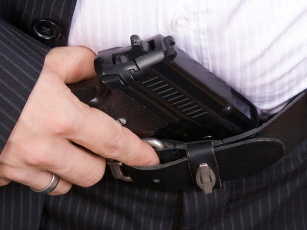 Businessman holding a pistol 