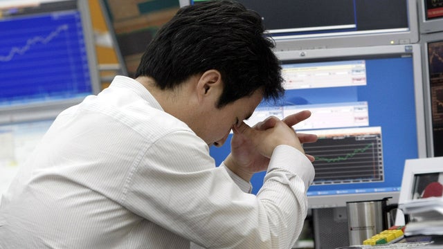 Currency trader at the Korea Exchange Bank in Seoul, S. Korea 