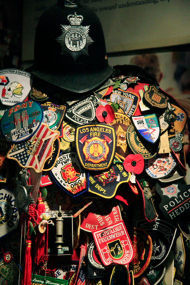 A collection of firefighters' uniform patches is displayed at St. Paul's Chapel in New York, July 19, 2011. 
