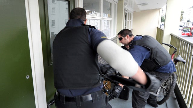 Police raid a property in Pimlico, London 