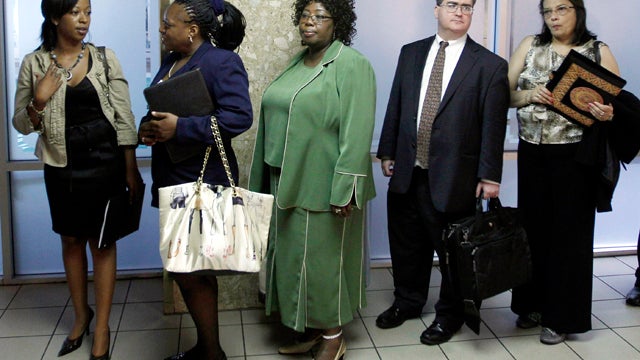 Job seekers line up to register at a job fair in Arlington, Va., Aug. 4, 2011. 
