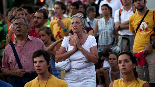 Pilgrims pray ahead of Pope Benedict XVI's visit to Madrid 