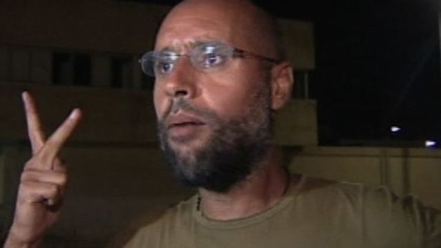 Qaddafi's son makes appearance after alleged arrest 
