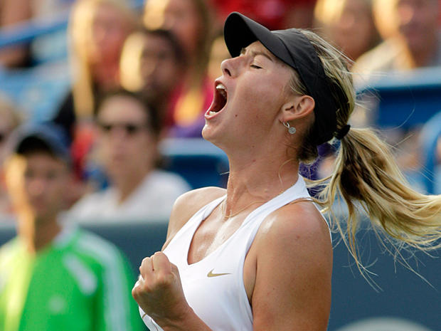 Maria Sharapova reacts after breaking Jelena Jankovic 
