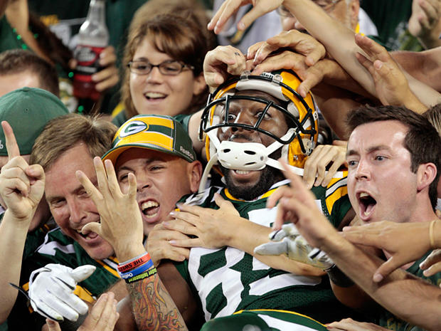 Greg Jennings reacts as he jumps in the crowd  