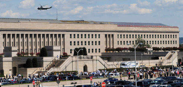 Civilians and military personnel evacuate the Pentagon in Washington after an earthquake was felt on  Aug. 23, 2011. 