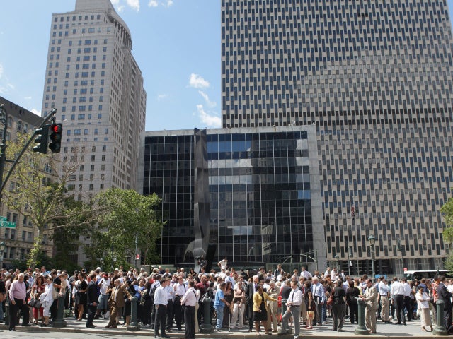 People stand in Foley Square after being evacuated from federal and state buildings surrounding it in New York on  Aug. 23, 2011, following an earthquake.  