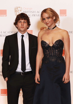 Jennifer Lawerance and Jesse Eisenberg pose during the Orange British Academy Film Awards at The Royal Opera House on February 13, 2011  in London 