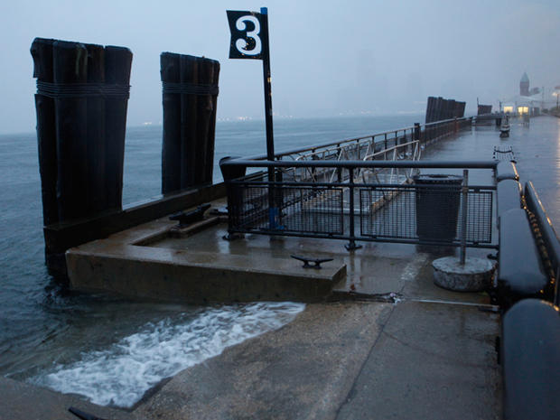 Rising water laps along the seawall in Battery Park 