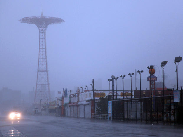 Coney Island boardwalk in New York is obscured by sand and rain as Hurricane Irene reached the area  