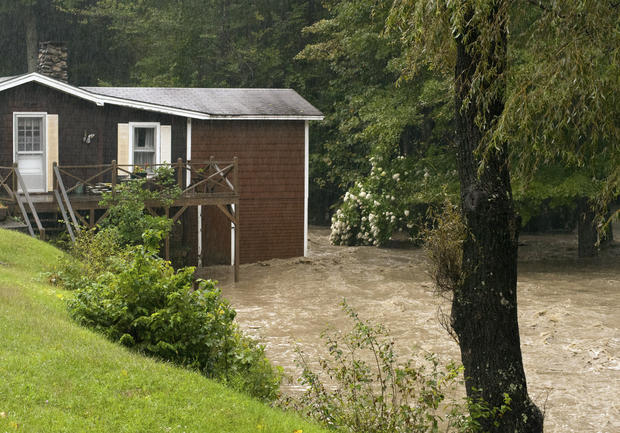 Smith Brook rises out of its banks and tugs at a home in Newfane, Vt. on,Aug. 28 2011. 
