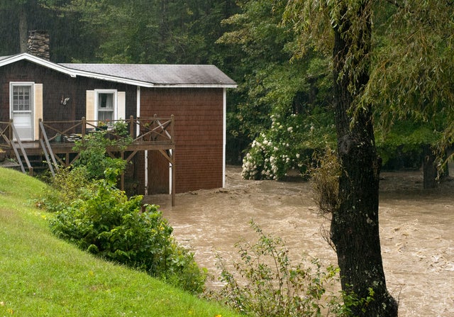 Smith Brook rises out of its banks and tugs at a home in Newfane, Vt. on,Aug. 28 2011. 