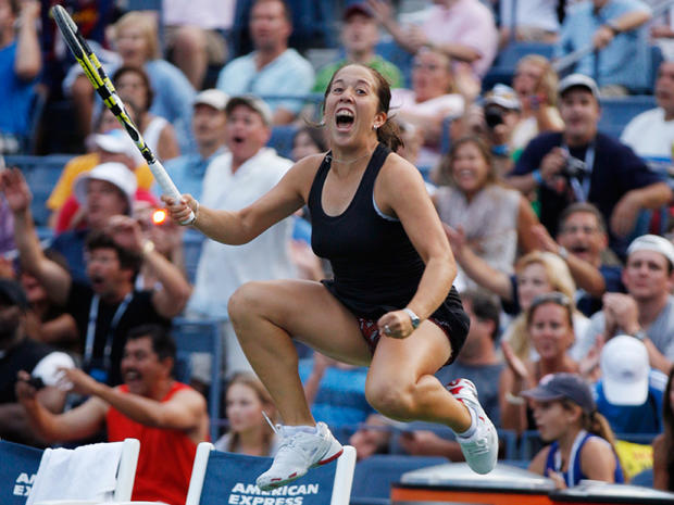 Irina Falconi leaps in the air after beating Dominka Cibulkova 